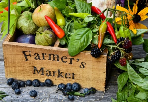 wood box with vegetables and the words farmers market on it