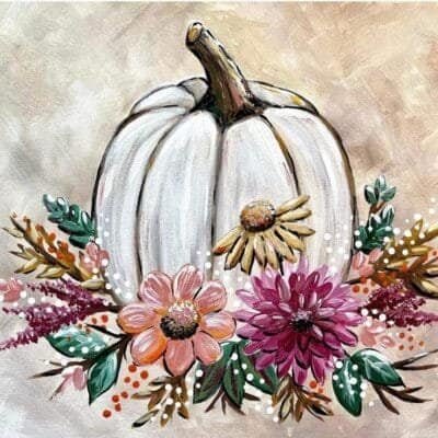 white pumpkin with colorful flowers