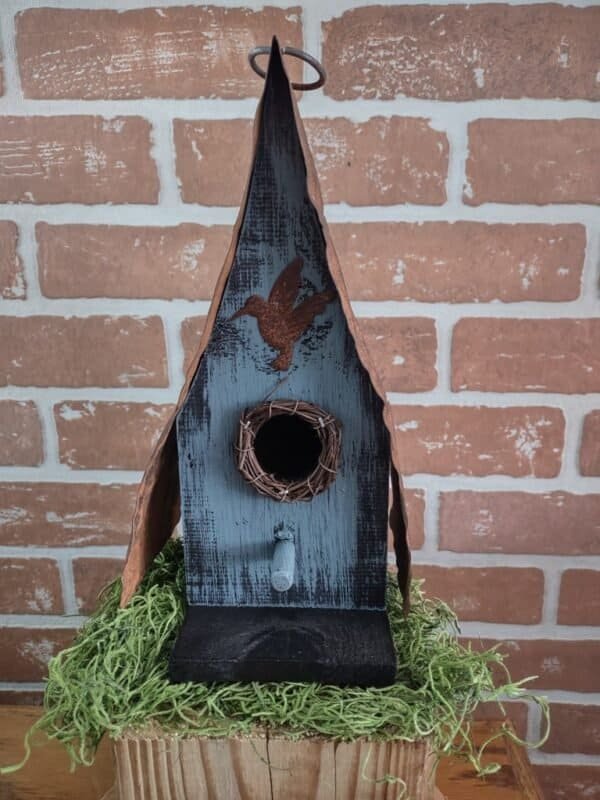 Blue Birdhouse with rusty roof