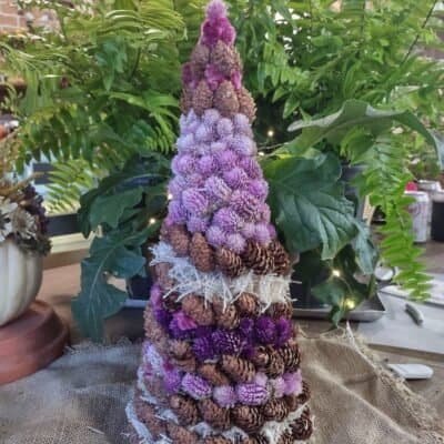 christmas tree made with dried flowers and pinecones