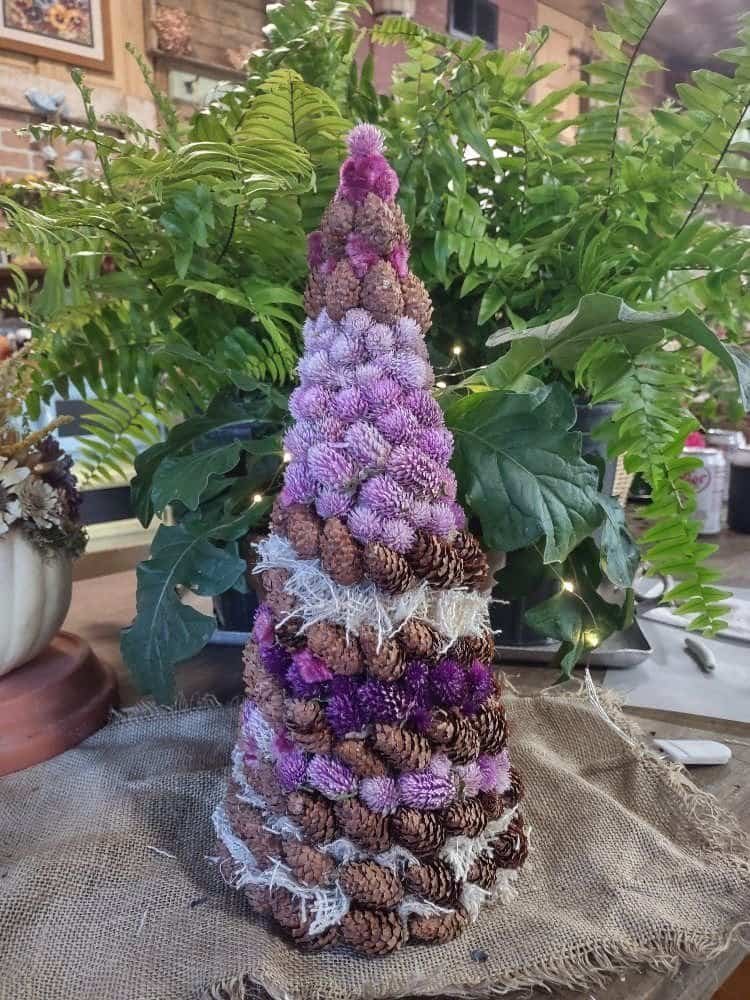 christmas tree made with dried flowers and pinecones