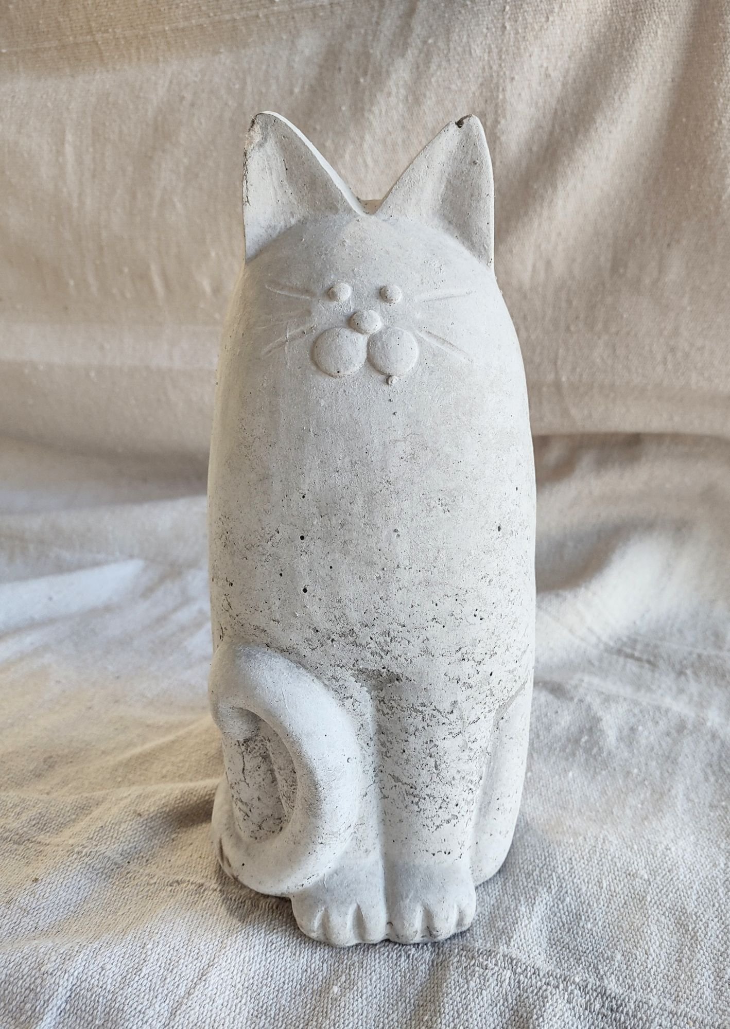 concrete skinny cat standing