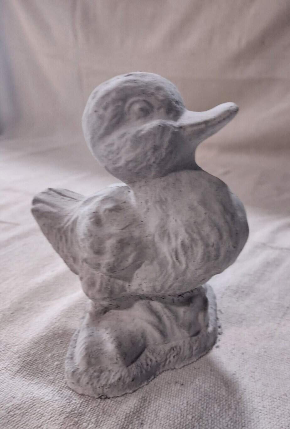 small concrete duck