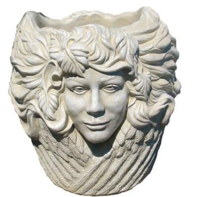 concrete flower pot with 3 faces around it