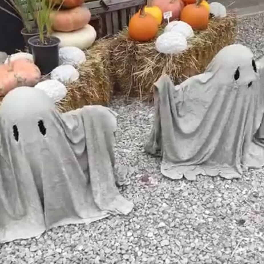 cement ghosts with arms up