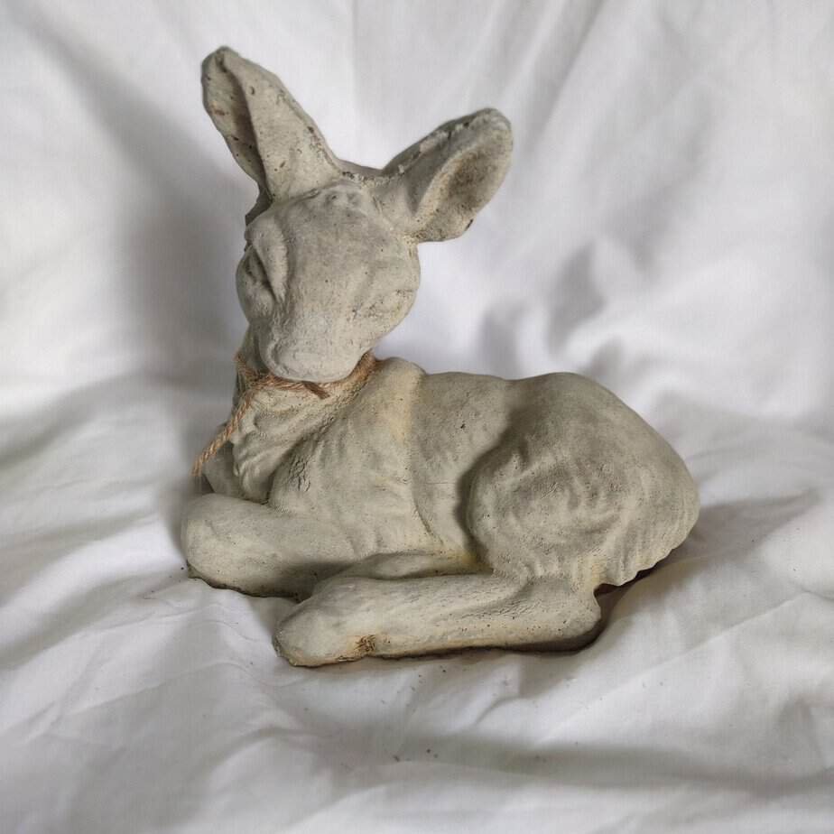 concrete deer laying