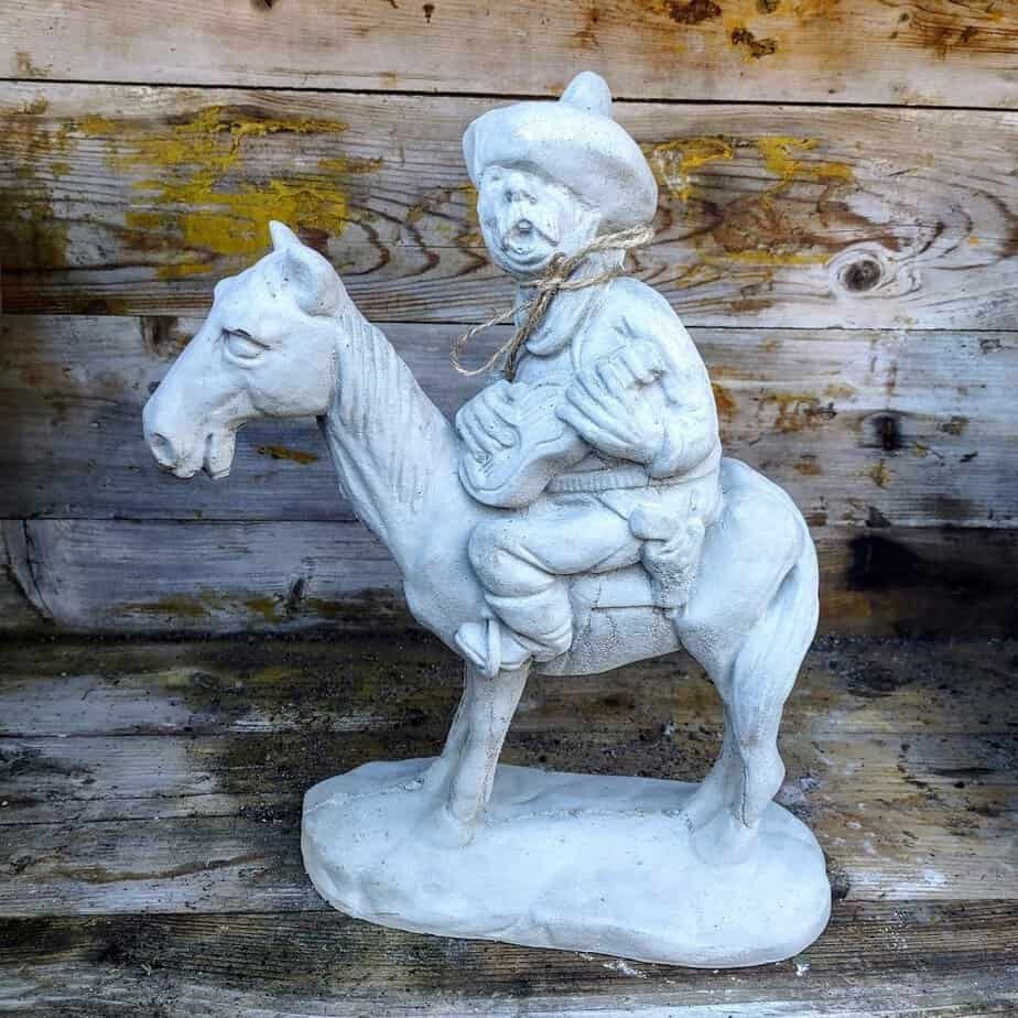 mexican with guitar on horse